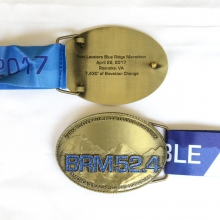 belt buckle race medal with back text for blue ridge marathon