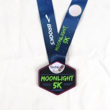 Glow in the dark race medal