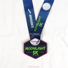Glow in the dark race medal
