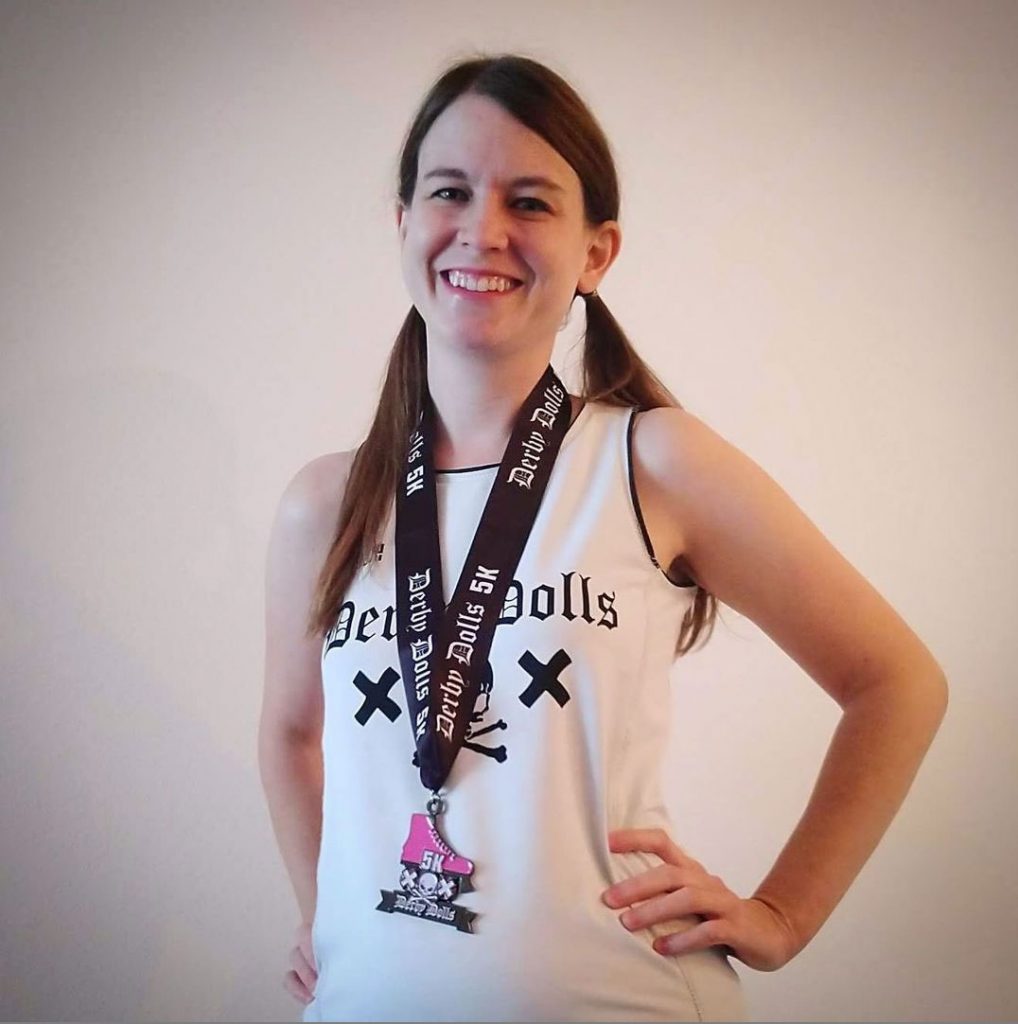 Runner wearing virtual 5K race fundraiser medal